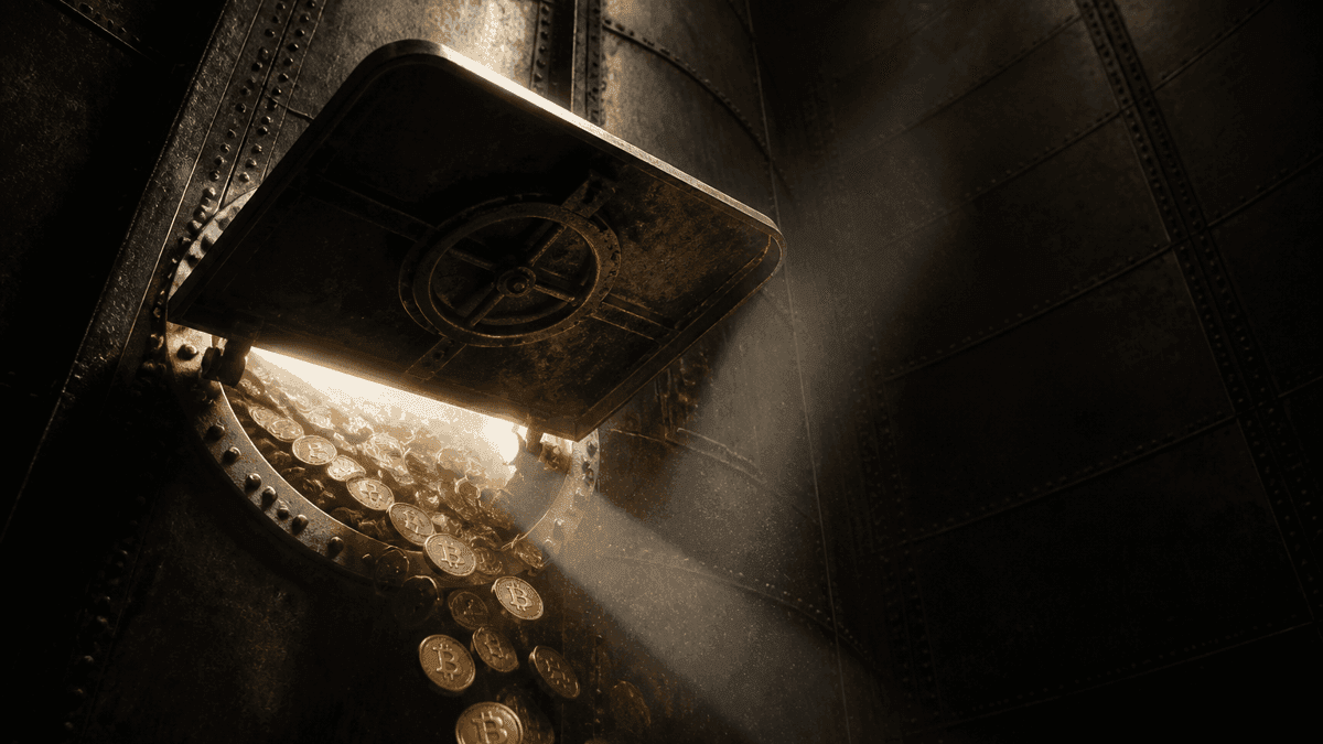 A view into a drained steel grain silo whose open floor hatch lets a last thin stream of coins bearing a Bitcoin symbol trickle into the darkness